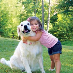 Girl hugging dog